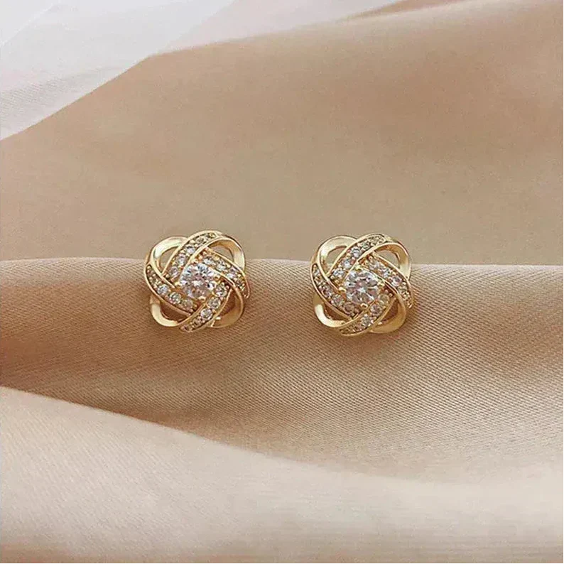Mélodie - Boucles d'oreilles dorées en spirale avec cristaux