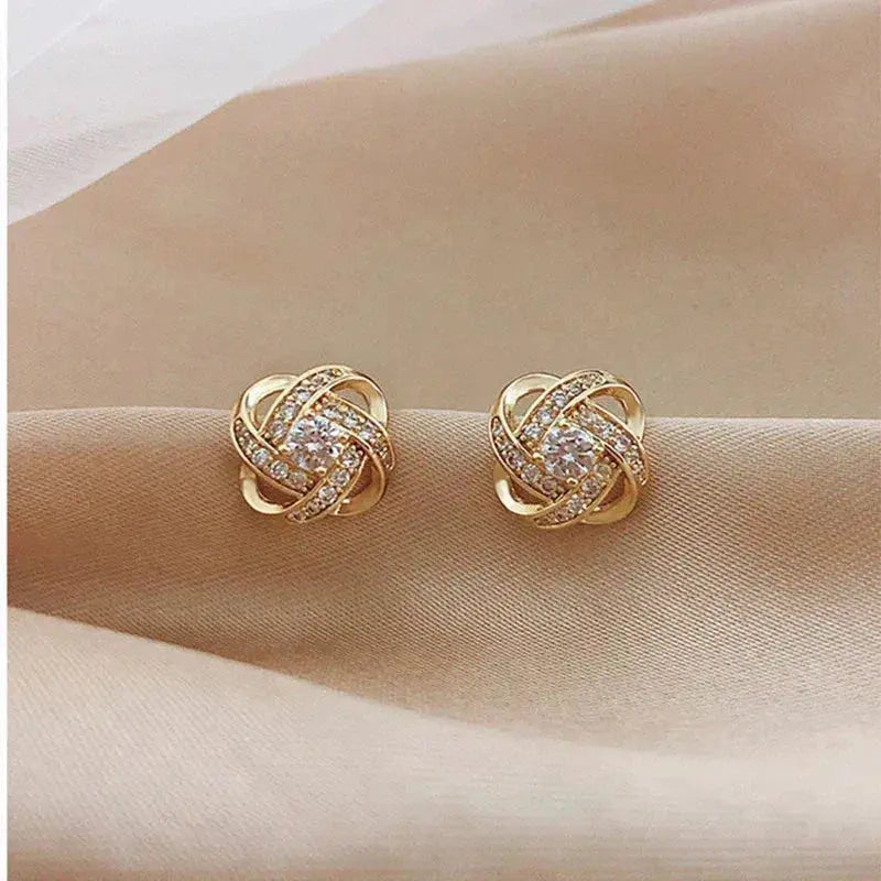 Mélodie - Boucles d'oreilles dorées en spirale avec cristaux
