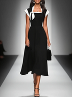 Ariane | Robe mi-longue à col carré et manches colorblock.
