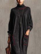 Manon | Robe longue noire à surpiqûres contrastées et poches plaquées