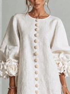 Paloma | Vestido texturizado de escote redondo y puños florales