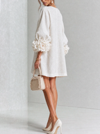 Paloma | Vestido texturizado de escote redondo y puños florales