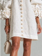 Paloma | Vestido texturizado de escote redondo y puños florales